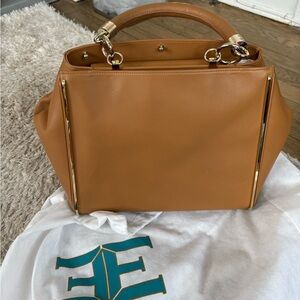 Eponymous New York tan leather bag. Brand new. With long strap.